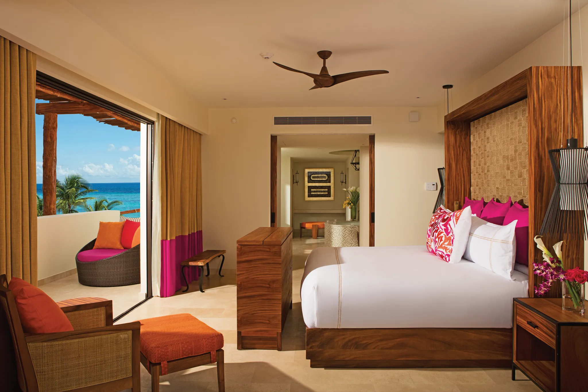 Presidential Suite bedroom with king bed and oceanfront balcony at Secrets Akumal Riviera Maya.
